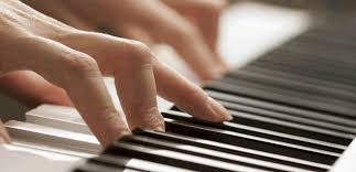 Hands playing piano